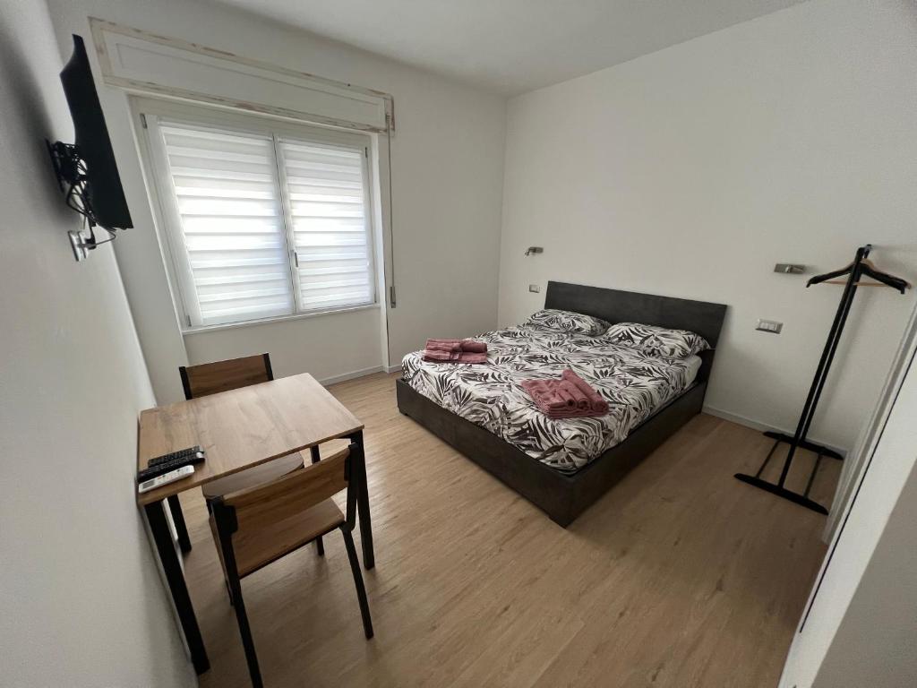 Postel nebo postele na pokoji v ubytování Lighthouse Affittacamere Alghero