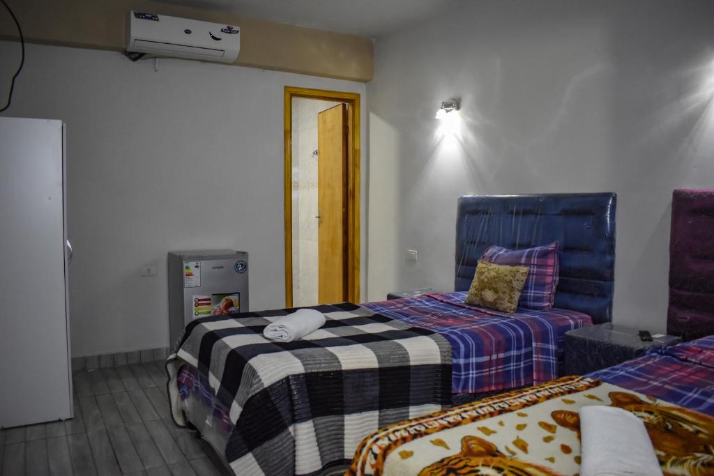 Postel nebo postele na pokoji v ubytování Ullanka Apart Hotel