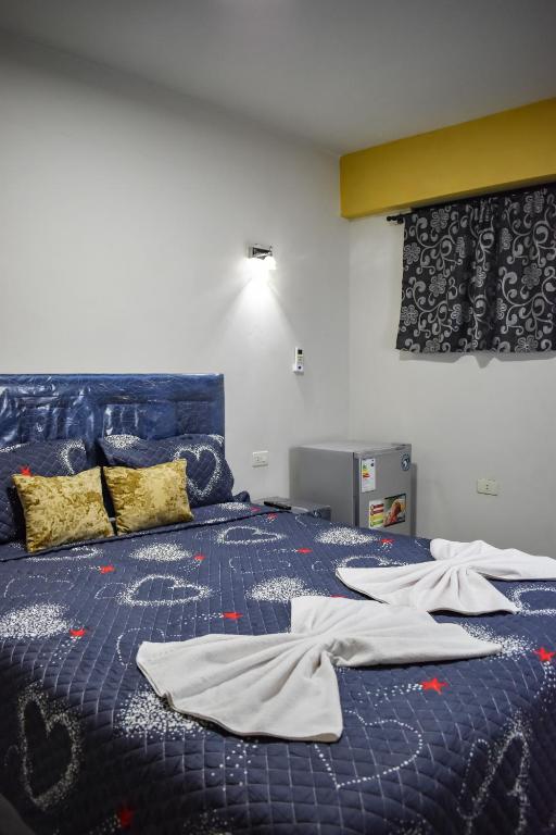 Postel nebo postele na pokoji v ubytování Ullanka Apart Hotel