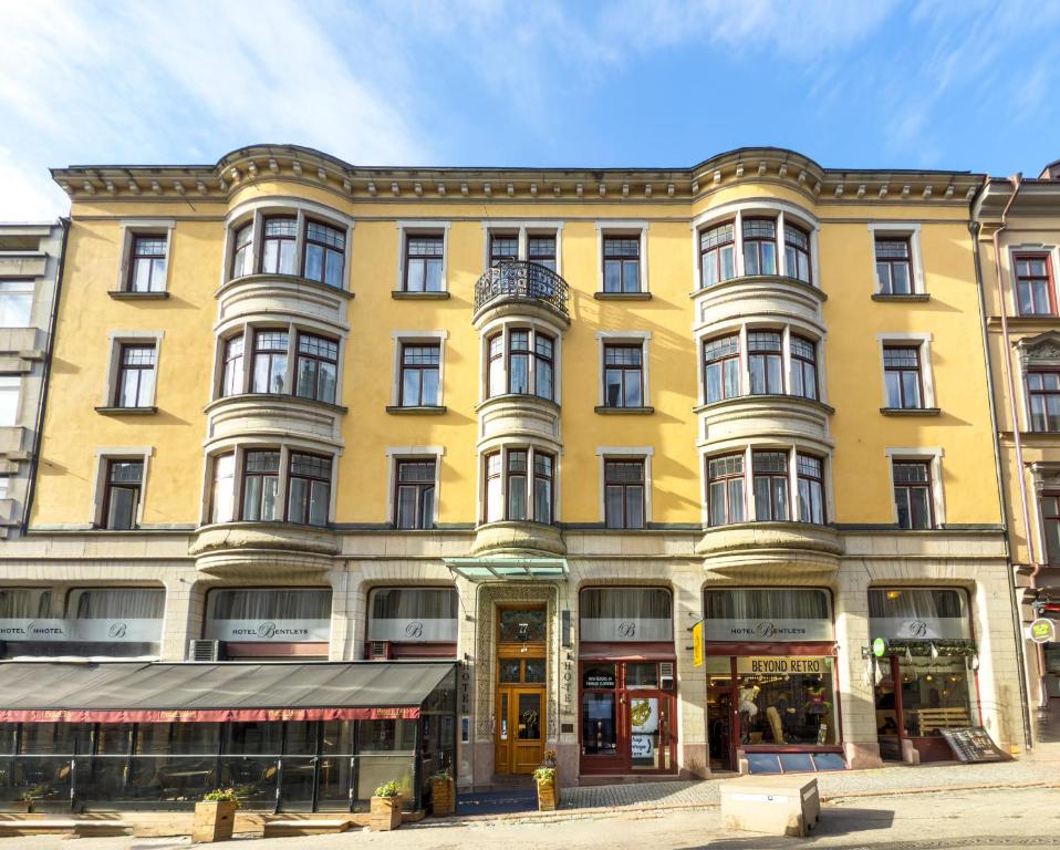 a large yellow building on a city street at Best Western Hotel Bentleys in Stockholm