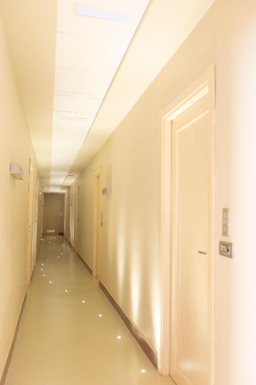 a corridor of an empty room with a door at Lungomare Suite & Spa in Naples