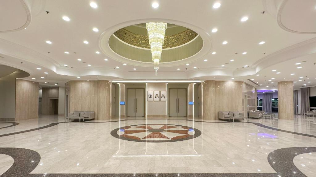 a lobby with a large room with a ceiling at Crowne Plaza Bahrain by IHG in Manama
