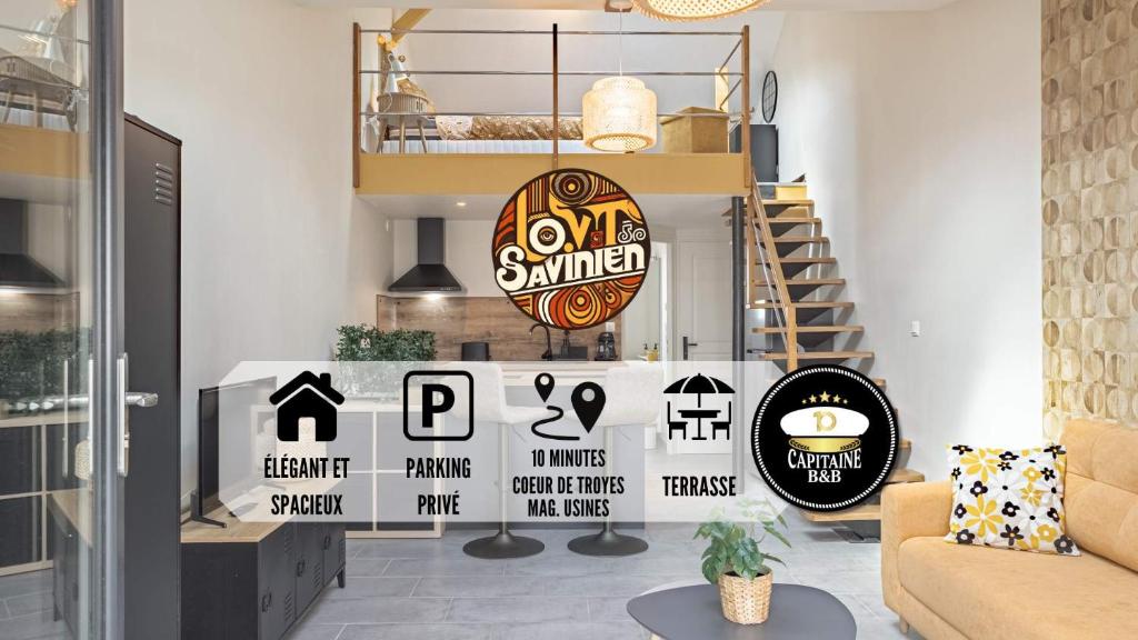 a living room with a staircase with signs on it at Le Loft Savinien - Proche Troyes - 3 pers in Sainte-Savine