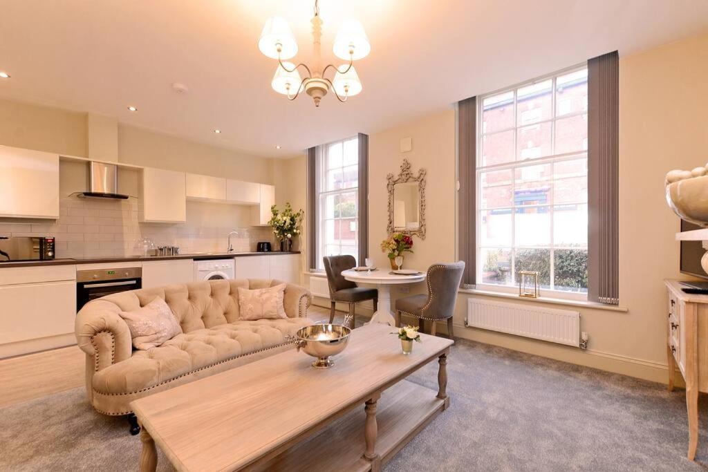 a living room with a couch and a table at The Bessemer Suite in Sheffield