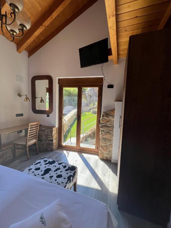 Postel nebo postele na pokoji v ubytování El hotel de Verdiago