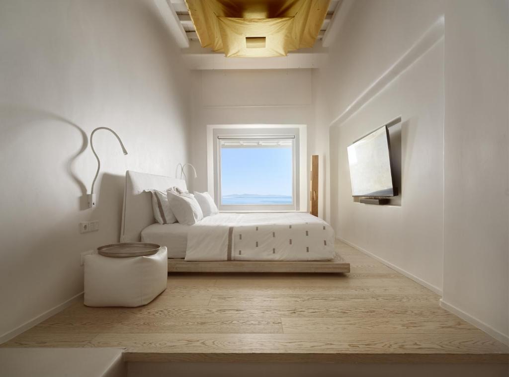Postel nebo postele na pokoji v ubytování Cavo Tagoo Mykonos