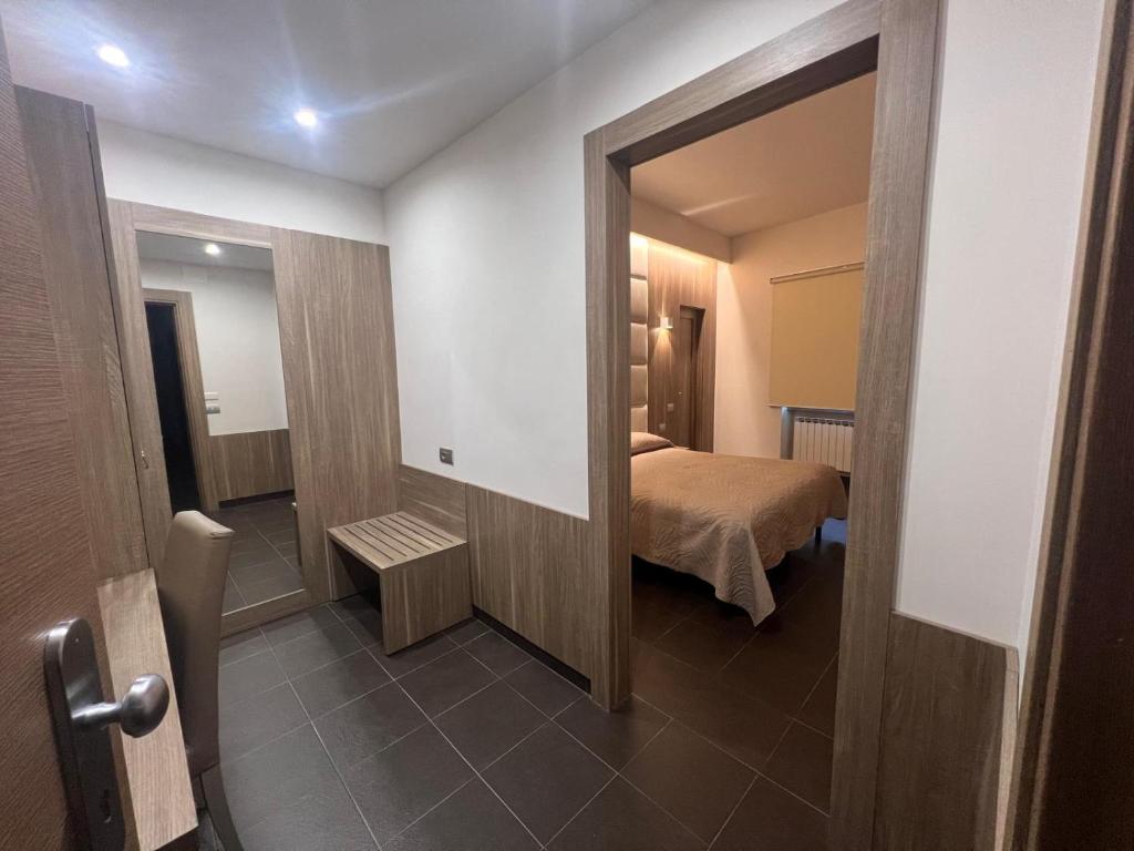 Postel nebo postele na pokoji v ubytování Hotel Ristorante Borgo Antico