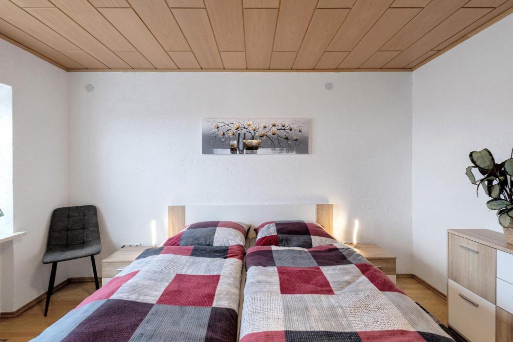 Postel nebo postele na pokoji v ubytování Naturoase Fichtelberg