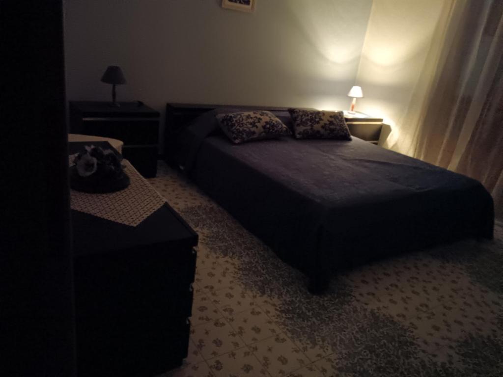 A bed or beds in a room at Costa Residence Vacanze