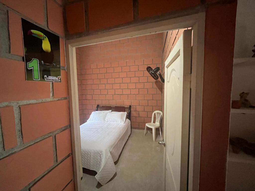 Postel nebo postele na pokoji v ubytování Hostal Macayaco