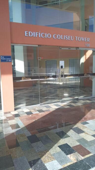 a glass door of a building with a coliseumavascriptavascriptveltveltvelt at Loft Temporada Praia do Meio in Natal