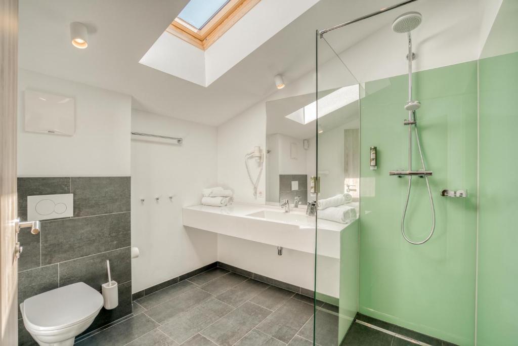 Kúpeľňa v ubytovaní COOEE alpin Hotel Kitzbüheler Alpen