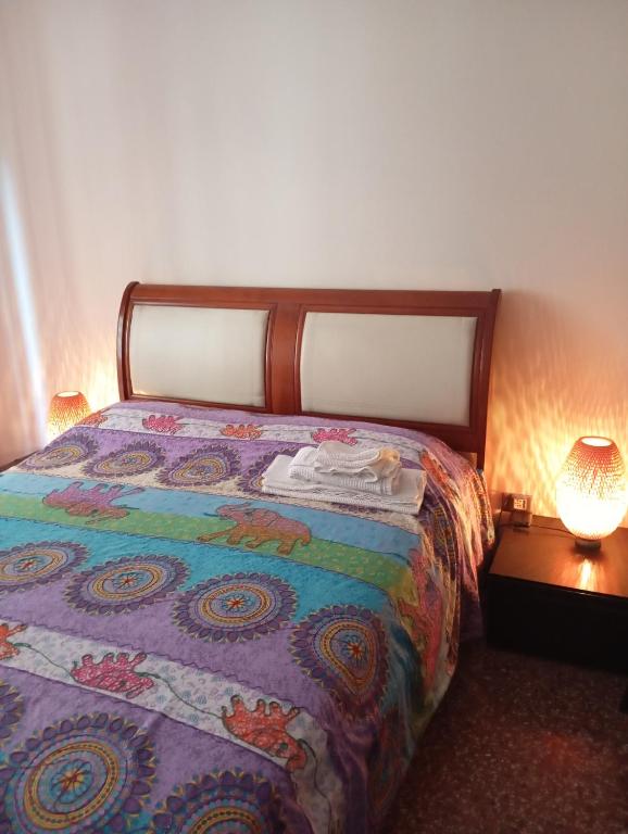 Łóżko lub łóżka w pokoju w obiekcie Liudan&rooms Affittacamere