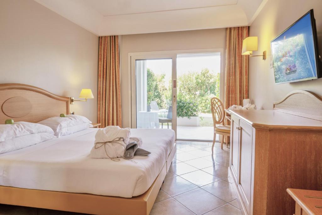 Postel nebo postele na pokoji v ubytování Palace Hotel Desenzano