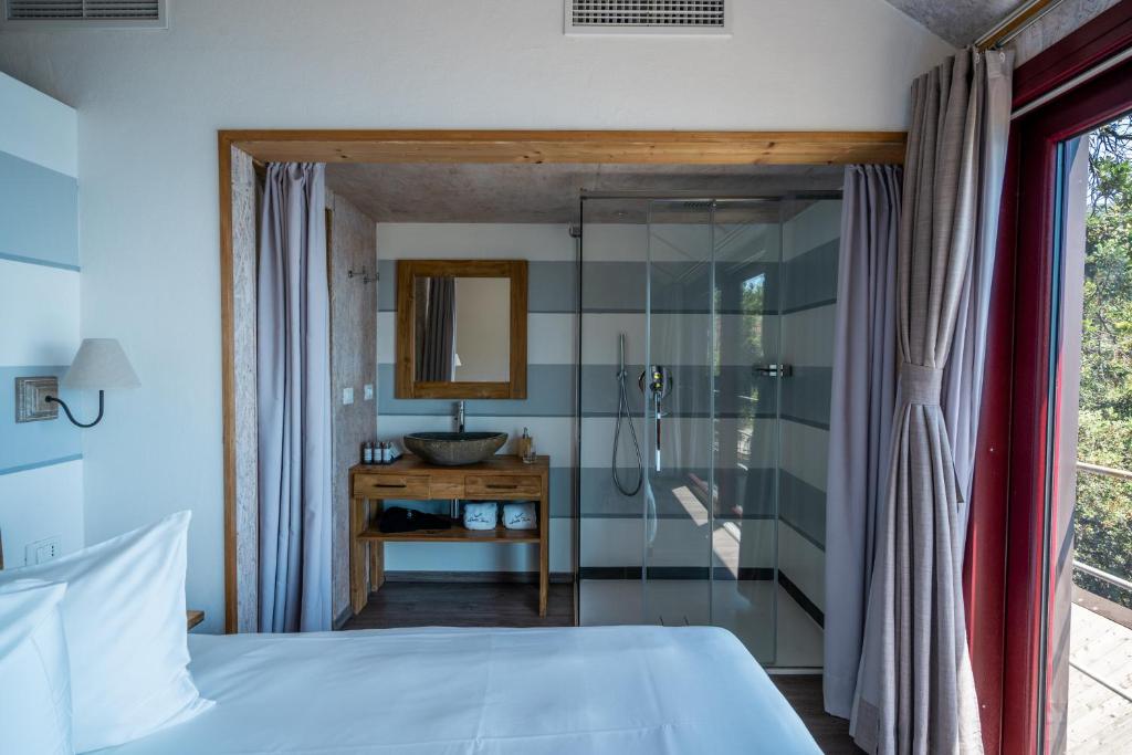 Postel nebo postele na pokoji v ubytování Sesta Terra Natural Resort
