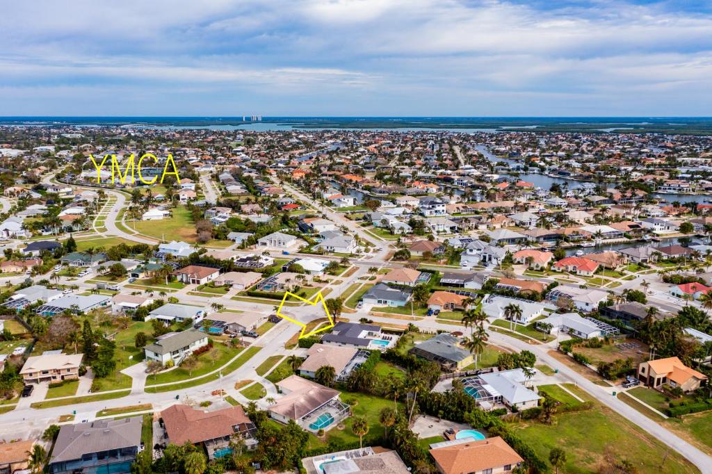 an aerial view of a city with a amusement park at New Listing I Stunning 4 Bed Home I Heated Pool & Hot Tub in Marco Island