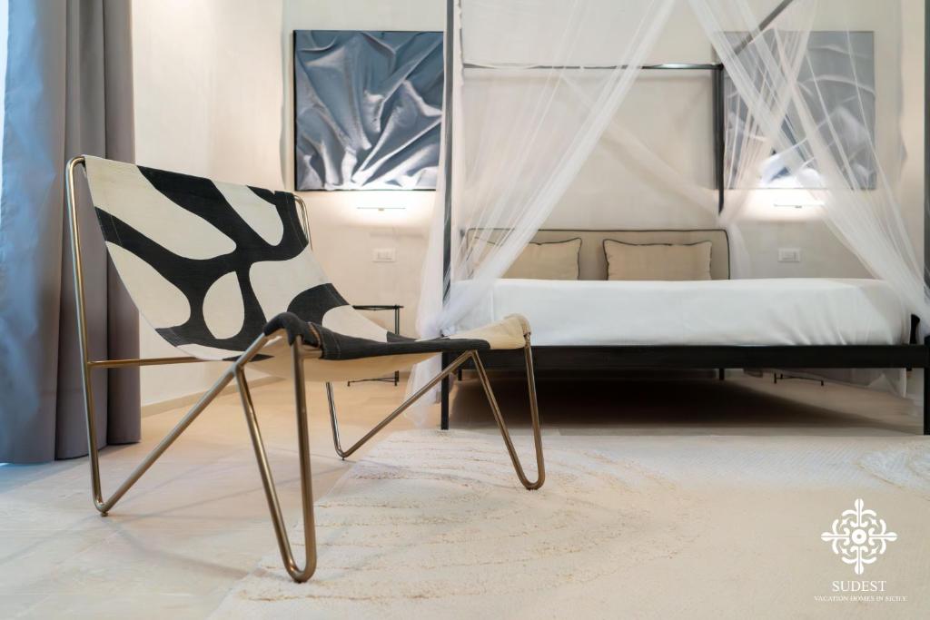 Postel nebo postele na pokoji v ubytování Casa Philomena - Noto Design Rooms