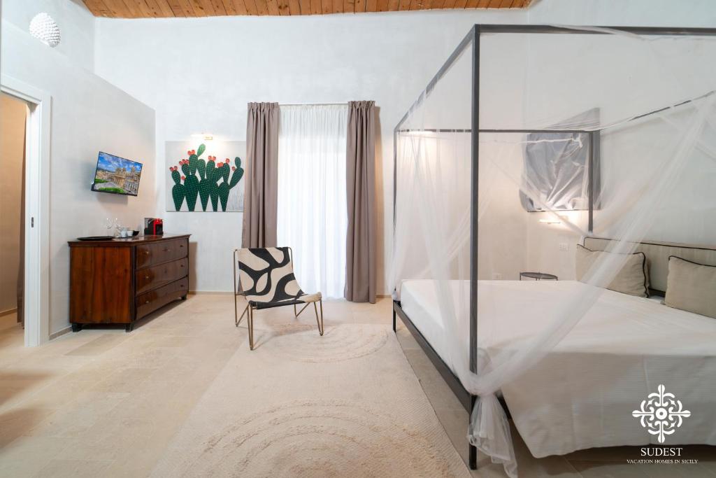 Postel nebo postele na pokoji v ubytování Casa Philomena - Noto Design Rooms