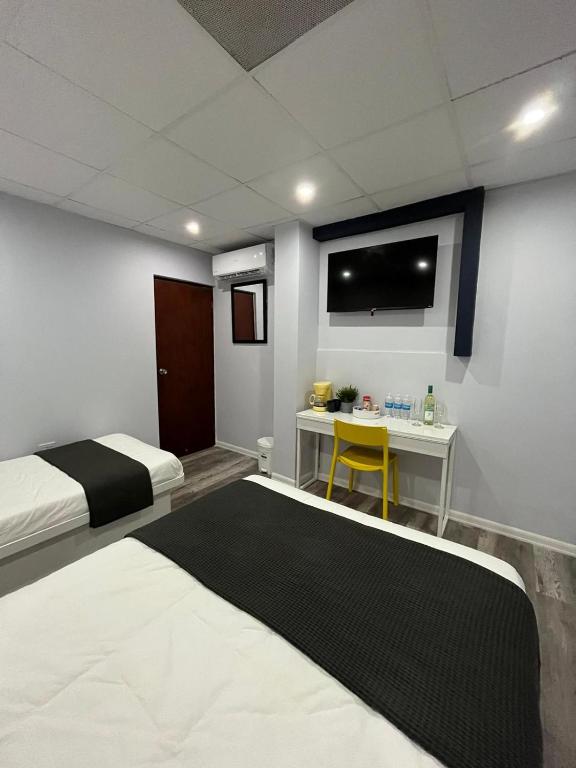 Postel nebo postele na pokoji v ubytování Hotel Libertad