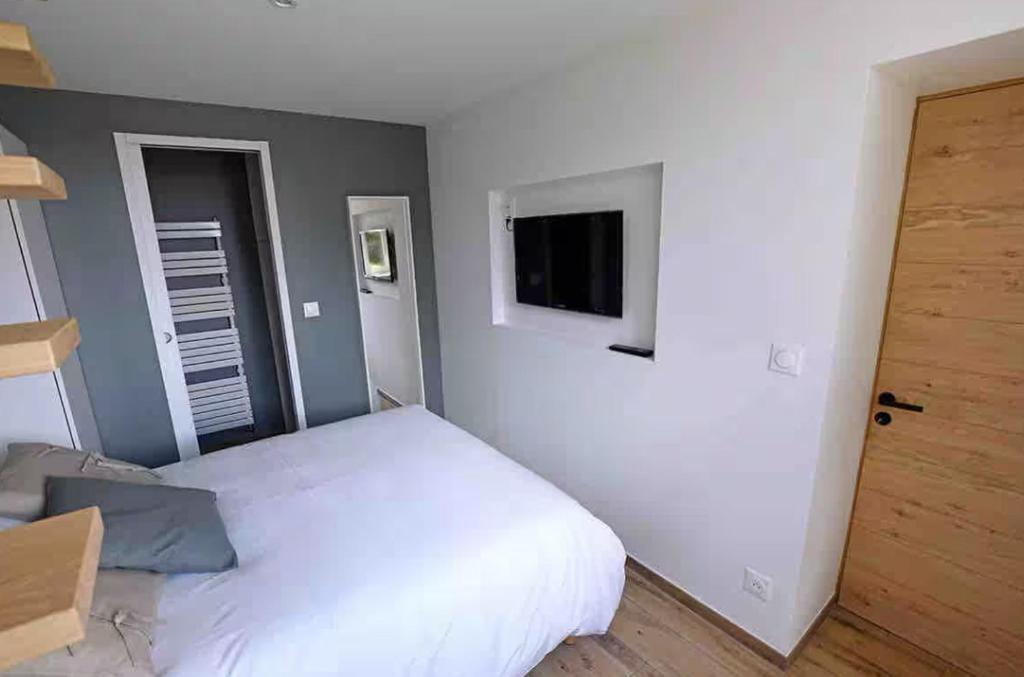 Postel nebo postele na pokoji v ubytování Ty Dag - La Désirade proche plage et jacuzzi