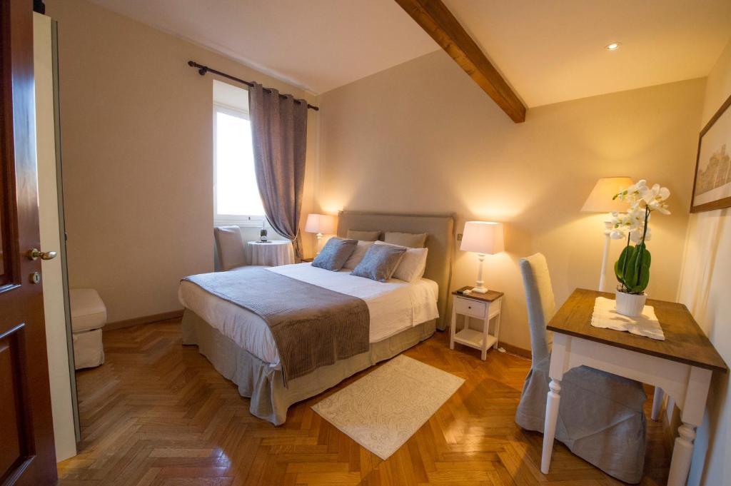 Säng eller sängar i ett rum på Bed & Breakfast A Casa di Lia a Roma