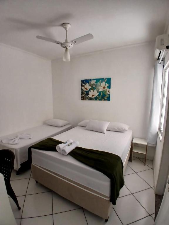 Postel nebo postele na pokoji v ubytování Hotel Aconchegante