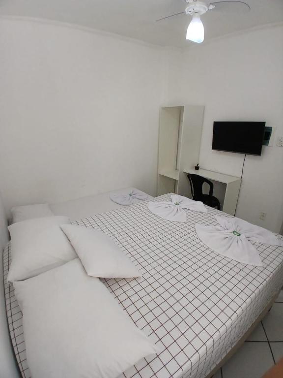 Postel nebo postele na pokoji v ubytování Hotel Aconchegante