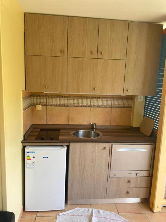 Kuchyň nebo kuchyňský kout v ubytování Le Mahogany Bleu
