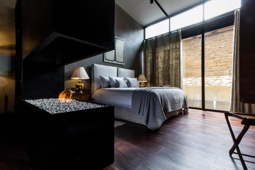 Postel nebo postele na pokoji v ubytování Uvence Arte + Hotel