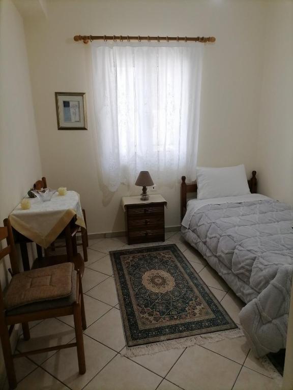 Postel nebo postele na pokoji v ubytování Lina's House Pramanta