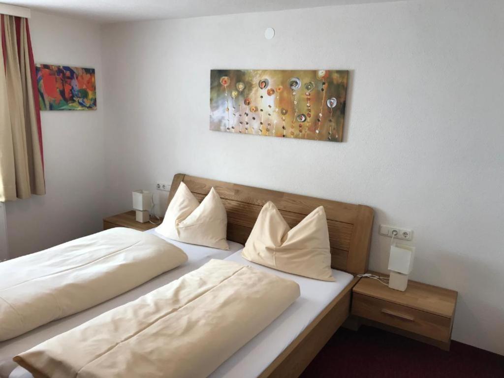 A bed or beds in a room at Haus Steissbach