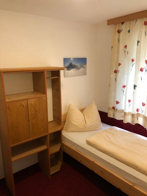 A bed or beds in a room at Haus Steissbach