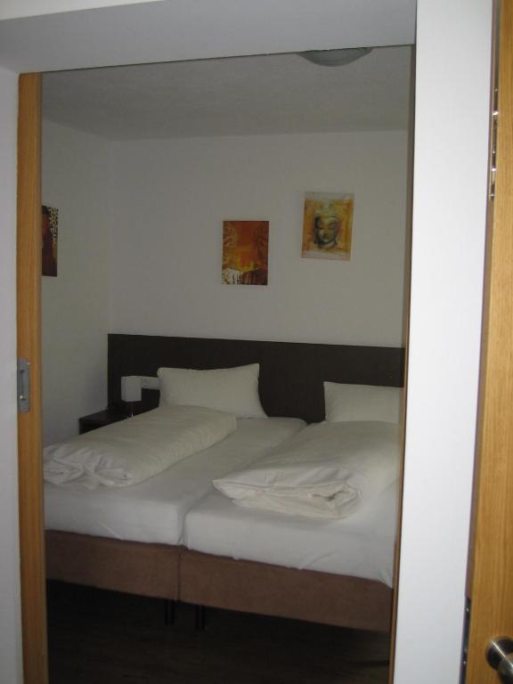 A bed or beds in a room at Haus Steissbach