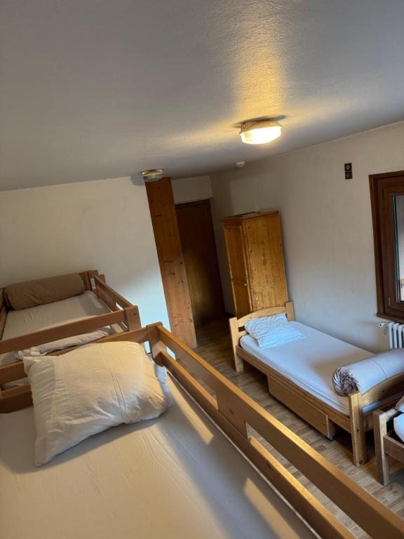 Postel nebo postele na pokoji v ubytování L'Ardesia