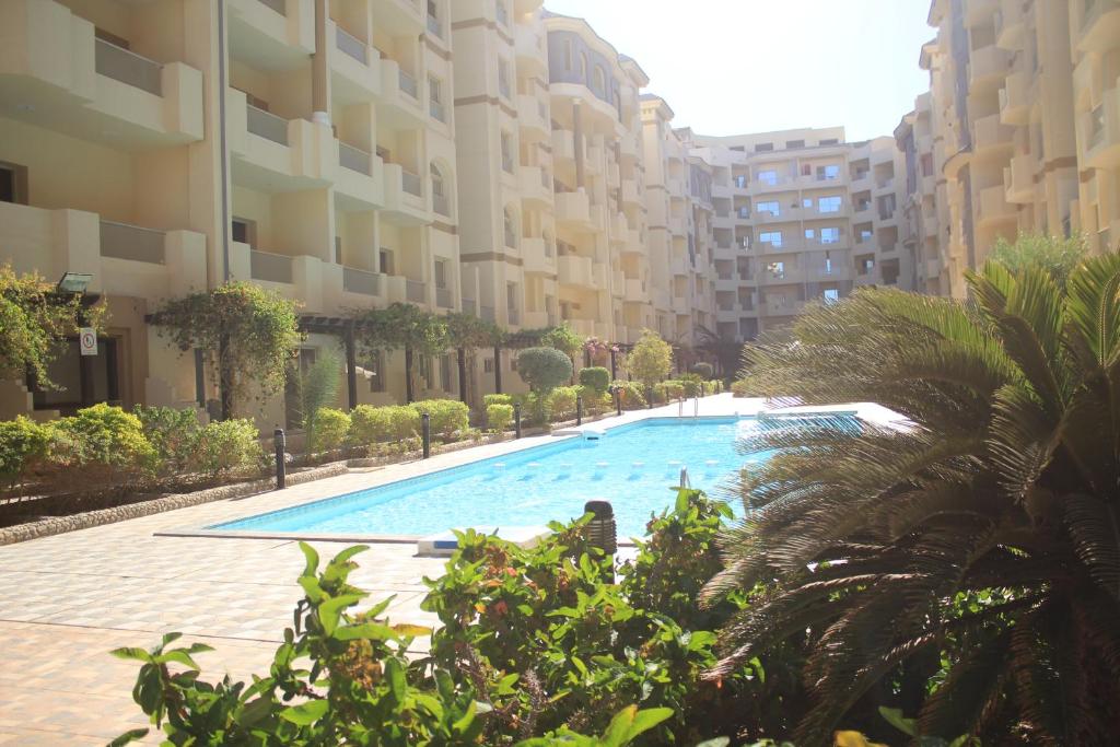 a swimming pool in the middle of a building at Florenza Resort- Hurghada in Hurghada