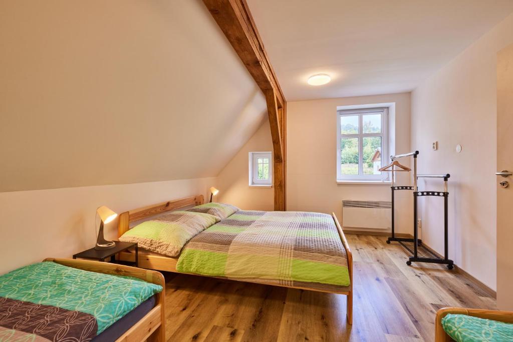 Postel nebo postele na pokoji v ubytování Apartmány Rudník Bolkov