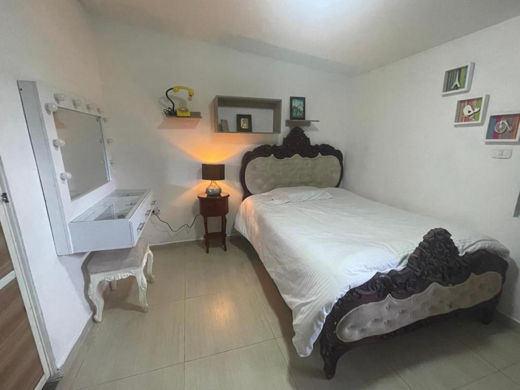 Een bed of bedden in een kamer bij Hostal los profes