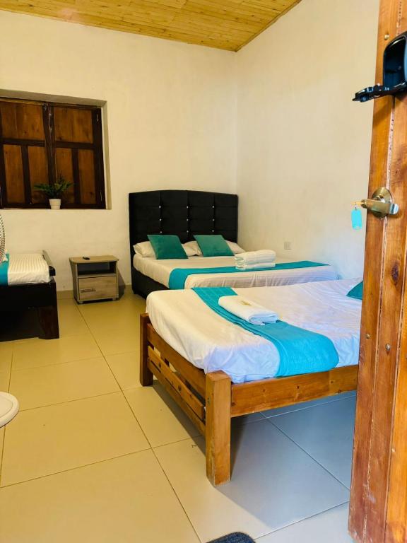 Postel nebo postele na pokoji v ubytování Hotel Alcázar Real