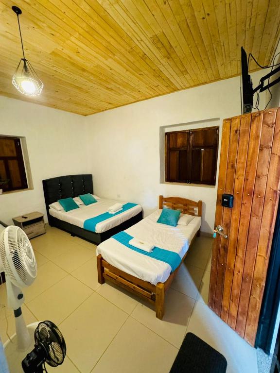 Postel nebo postele na pokoji v ubytování Hotel Alcázar Real
