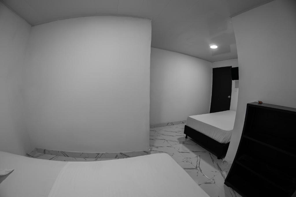 Postel nebo postele na pokoji v ubytování Hotel Santander Express
