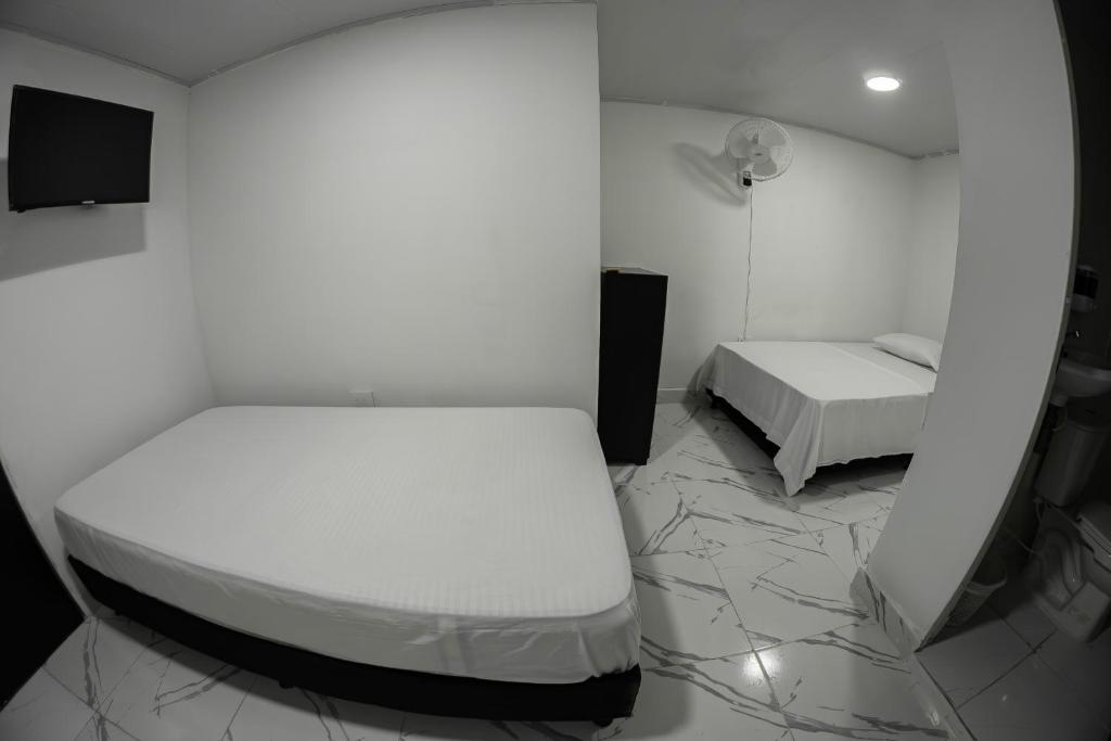 Postel nebo postele na pokoji v ubytování Hotel Santander Express