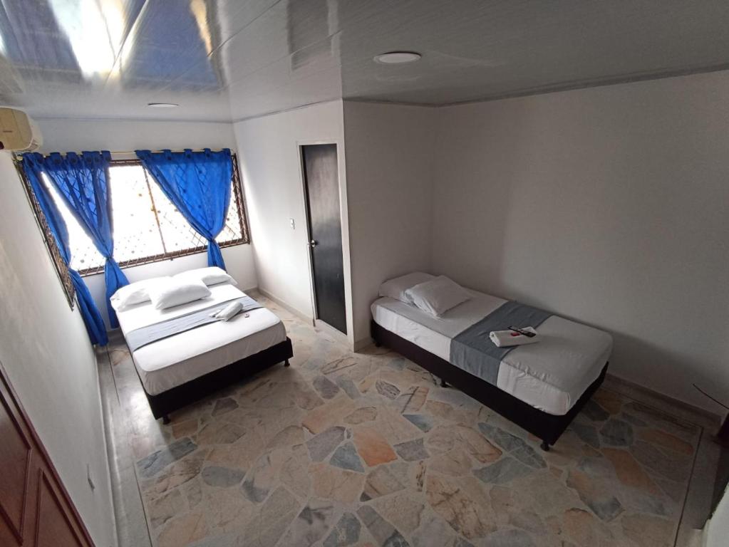 Postel nebo postele na pokoji v ubytování Hotel Santander Express