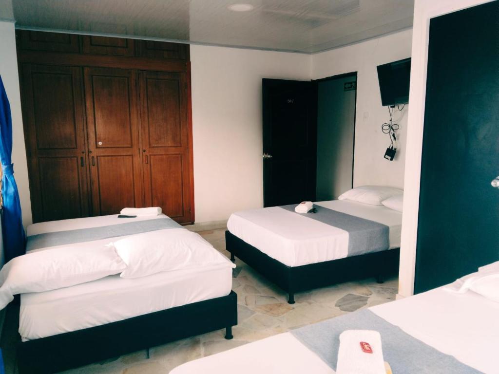 Postel nebo postele na pokoji v ubytování Hotel Santander Express