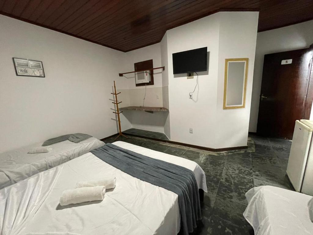 Cama ou camas em um quarto em Pousada Terra Do Sol