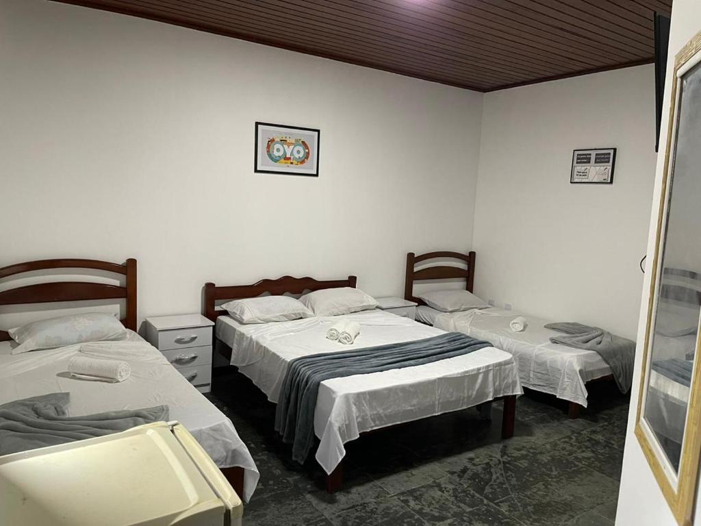 Cama ou camas em um quarto em Pousada Terra Do Sol
