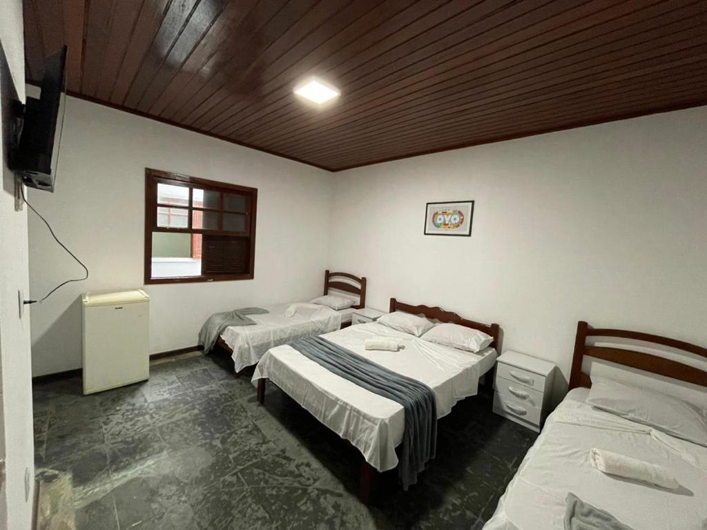 Cama ou camas em um quarto em Pousada Terra Do Sol