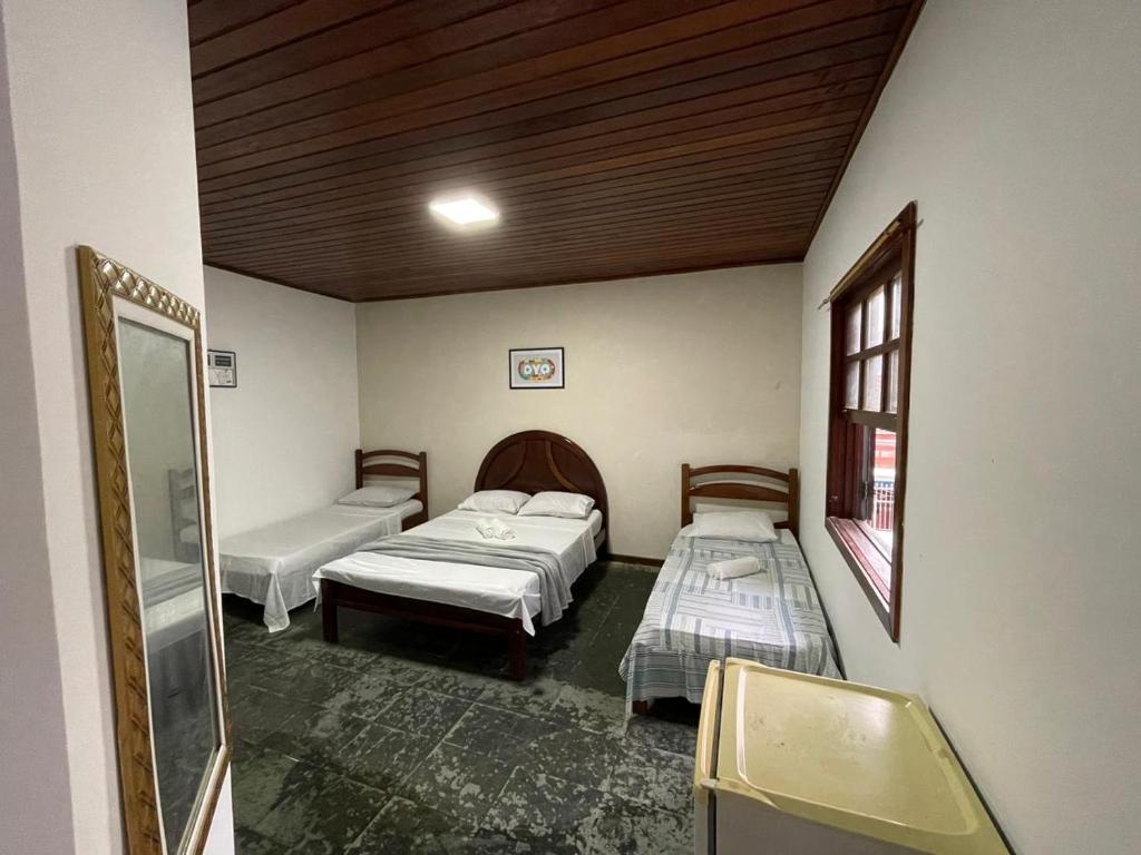 Cama ou camas em um quarto em Pousada Terra Do Sol