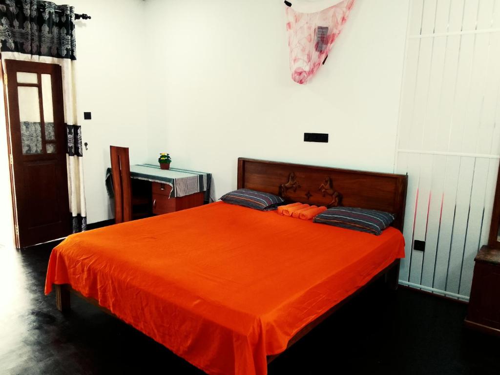 Postel nebo postele na pokoji v ubytování Mirissa Surf Villa