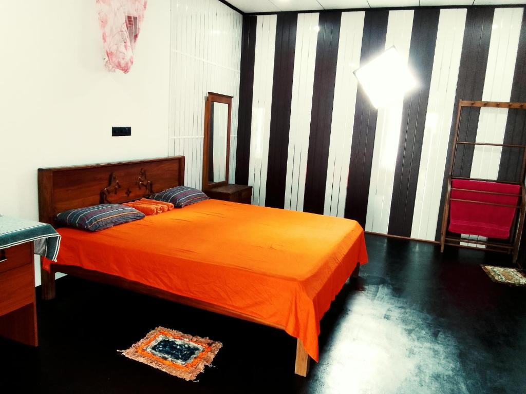 Postel nebo postele na pokoji v ubytování Mirissa Surf Villa