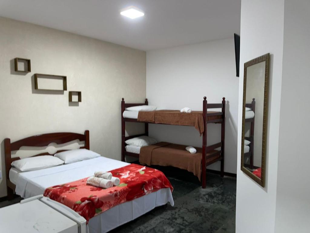 Cama ou camas em um quarto em Pousada Terra Do Sol